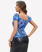 Back view of blue swirl print sheer mesh off-shoulder top with puff sleeves
