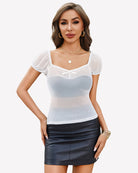 White sheer mesh off-shoulder top with bow tie, short puff sleeves, fitted bodice