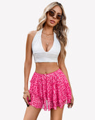 Pink leopard print pleated mini skirt with layered ruffle hem