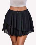 Black pleated mini skirt with layered asymmetrical ruffle hem