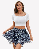 Navy floral mesh skort with ruched drawstring waist and asymmetric ruffle layers