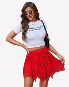 Red mesh skort with ruched drawstring waist and tiered ruffle hem