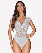 White lace V-neck bodysuit with scalloped lace trim and high-cut briefs