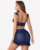 Navy lace bra and sheer mesh bodycon dress from back, with ruffled hem