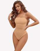 Square-neck tank bodysuit in nude with thin spaghetti straps and ruched sheer front