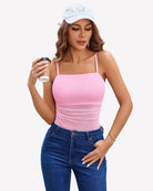 Square-neck tank bodysuit in blush pink with thin spaghetti straps and ruched sheer front