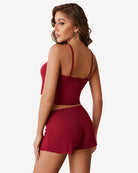 Wine red ribbed cami pajama set with open-back straps and matching drawstring shorts