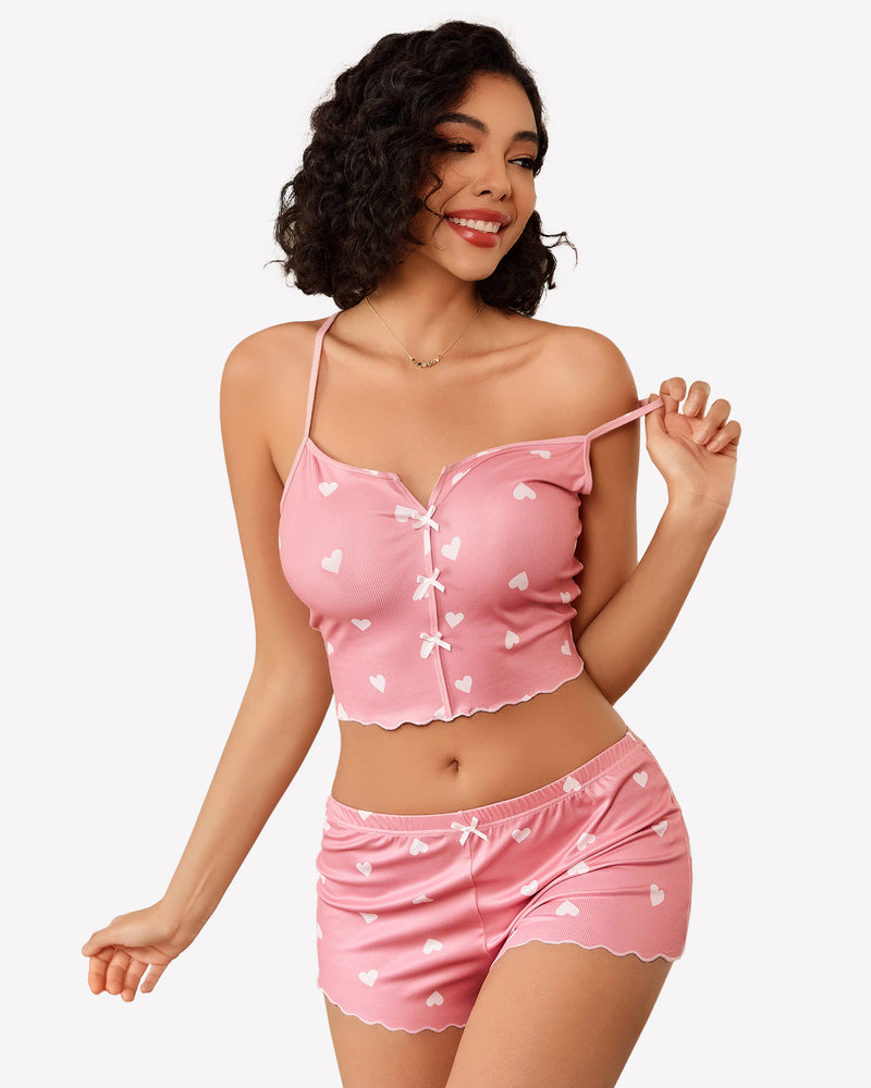 Cami pajama set, pink heart-print cami top with tie-front and matching shorts, side view.