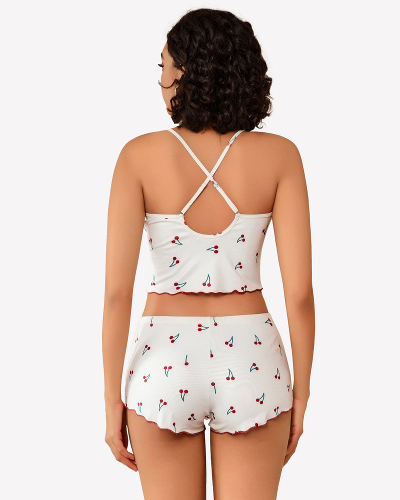Cami pajama set, white cherry-print cami top and matching shorts with crisscross straps, back.