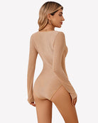 Nude sparkle mesh long-sleeve bodysuit with open-back thong cut and seam detailing.