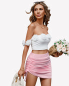 Pink ruched mini skirt with side drawstring ties and gathered ruching detail