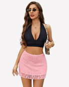 Pink lace mini skirt with sheer mesh overlay and scalloped hem, high-waist fit.