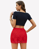 Red lace mini skirt with sheer overlay and scalloped hem, side view from back.