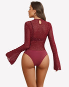 Wine red long sleeve rhinestone bodysuit with open back and flared bell sleeves.