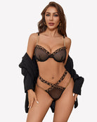 Leopard print push-up bra and panty set with gold chain accents, black sheer mesh