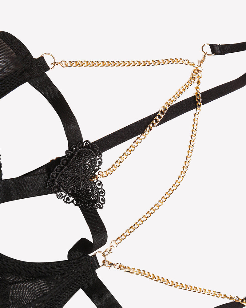 Black chain-heart cutout bra lace heart with gold-tone chain links close-up