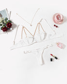 White chain-heart cutout bra and thong set with adjustable back closures