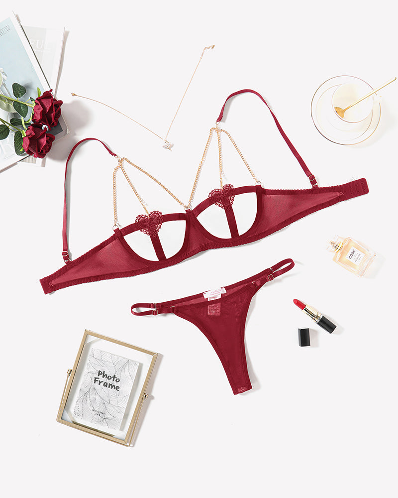 Red heart cutout bra and panty set with lace detailing and gold-tone chain