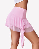 Pink mini ruffle skirt with layered asymmetric tiers and flowing side ruffle