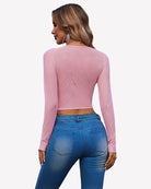 Light pink long-sleeve rhinestone crop top, back view