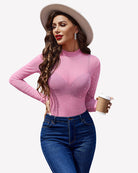 Sheer rhinestone mesh top with long sleeves and high neck, hot pink with scattered rhinestones