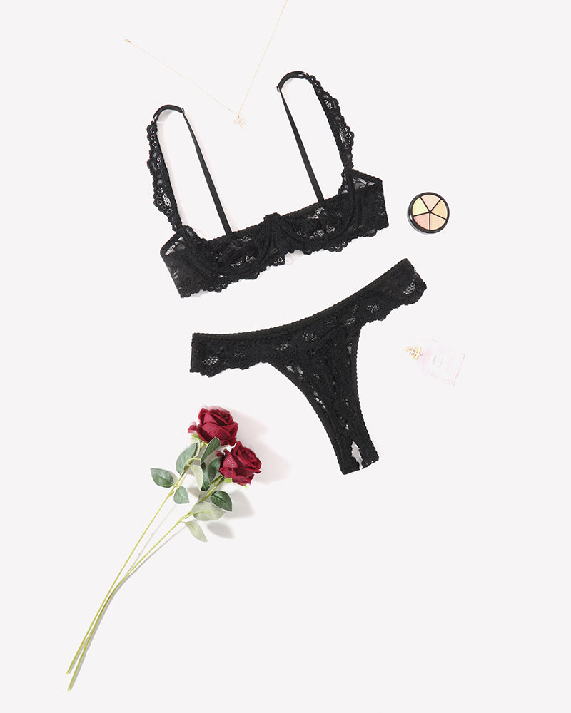 Black lace push-up bra and thong panty set, set shown from angled front.