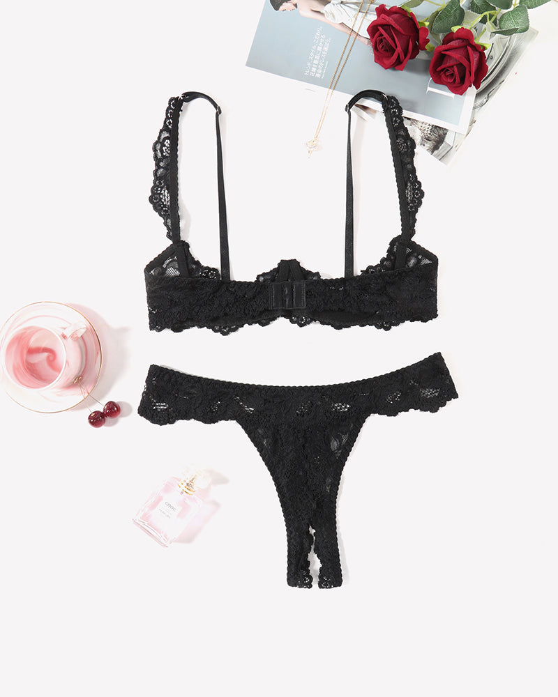 Black lace push-up bra and thong panty set with scalloped edges.