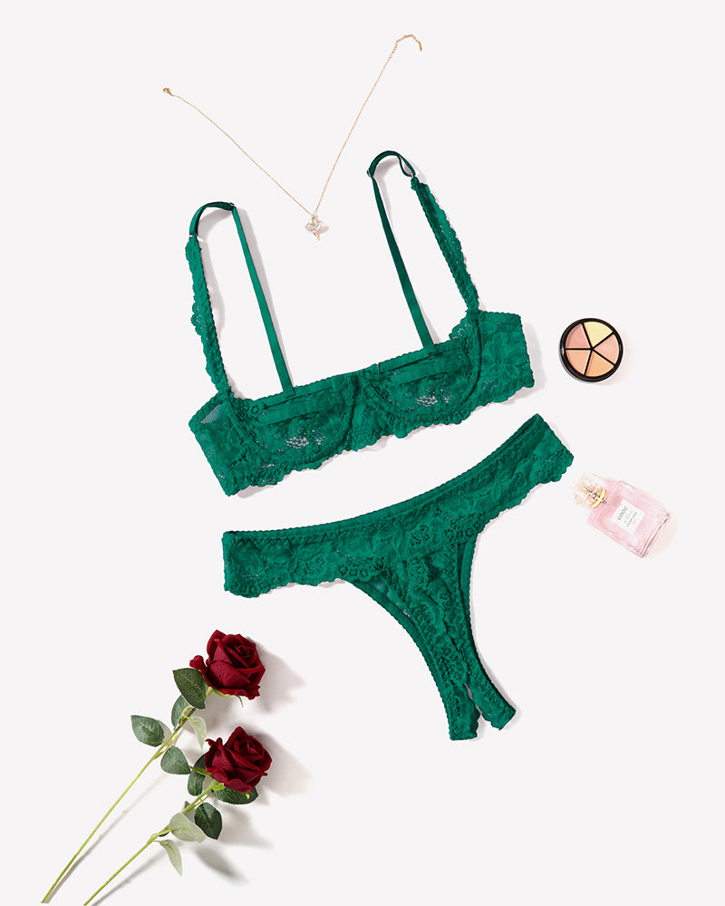 Green lace push-up bra and thong panty set, angled view with lace straps.