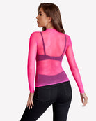 Fluorescent pink fishnet mesh long sleeve top, back view with sheer high neckline