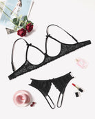 Black lace bra and panty set laid flat, adjustable straps