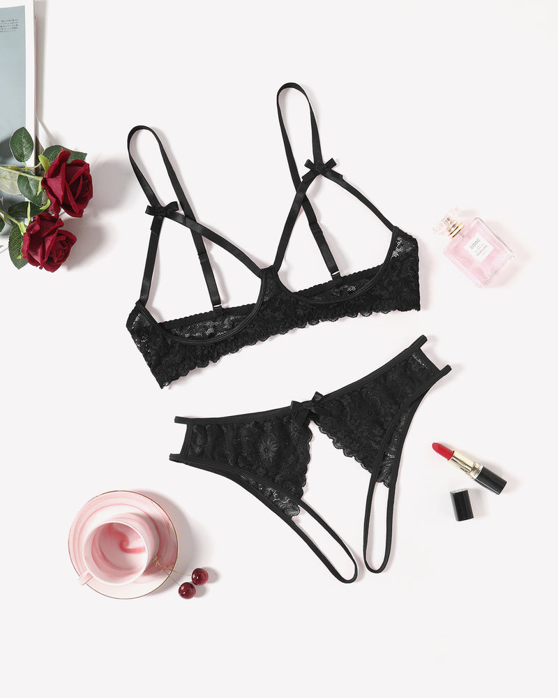 Black lace lingerie set with bra and thong-style panty, bow details