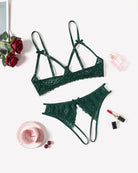 Green lace bra and thong-style panty set, laid flat