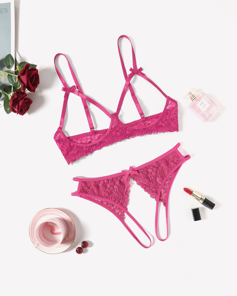 Rose red lace bra and thong set laid flat, with bow accents and scalloped edges
