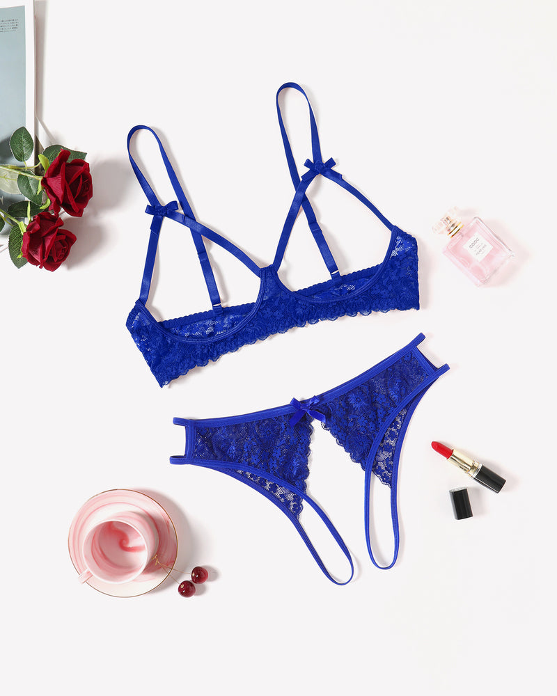 Blue lace bra and thong set laid flat, bow details, scalloped hem, thin straps
