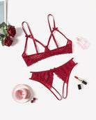 Red lace bra and panty set with bow tie straps and lace-trim edges