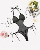 Black mesh deep V teddy bodysuit with cutout front and tie bow straps (flat lay)