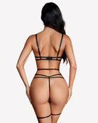 Back view of black lace lingerie set with cutouts and garter straps