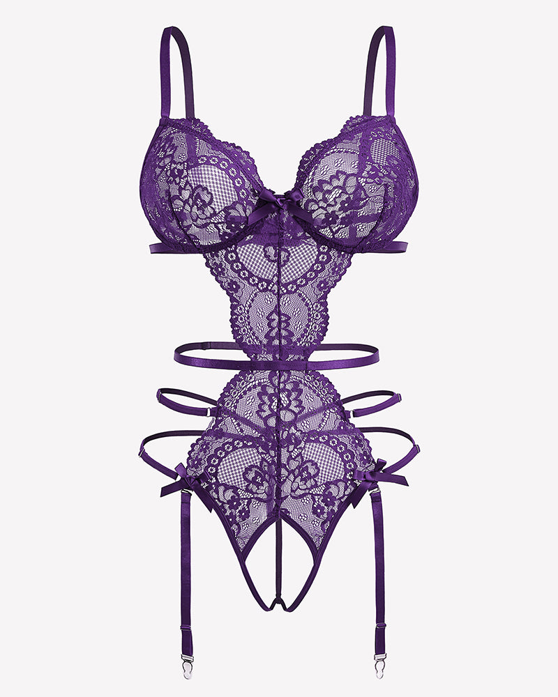 Purple lace lingerie set with deep V bra, cutouts, and garter straps, flat lay
