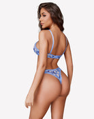 Blue mesh lace bra and matching daisy-print panty set, side view from back