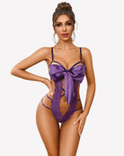 Purple lace teddy bodysuit with satin bow front and strappy neckline