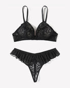 Black mesh lace bra and thong panty set with ruffle trim, flat lay