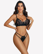 Black lace wireless bra with matching thong panty, strappy detailing
