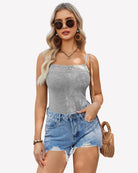 Gray lace-trim cami with spaghetti straps and scalloped lace neckline, styled under denim shorts
