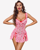 Pink heart print mesh ruffle mini dress with bow side details and thong
