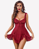 Red mesh babydoll dress with ruffled hem and bow details, front view