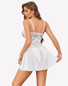 White lace babydoll nightie with thin back straps and flared sheer skirt