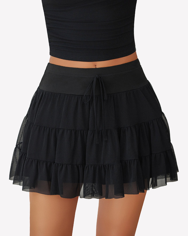 Black pleated mini skirt with ruffle tiers and drawstring waist