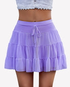 Purple pleated mini skirt with tiered tulle layers and drawstring tie
