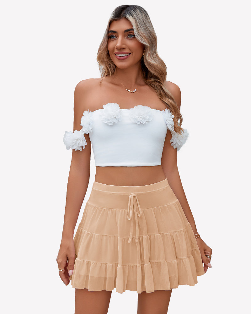 Beige pleated mini skirt with tiered ruffle layers and elastic drawstring waist