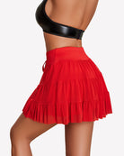Red pleated mini skirt with tiered ruffles and drawstring waist